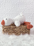 Handmade silly goose crochet plushie with a whimsical exaggerated design