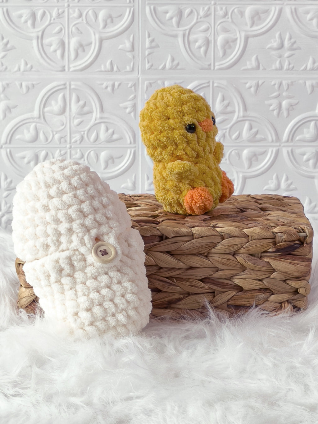 Handmade cream, yellow peek a boo chick in egg crochet plushie shown from an angled view