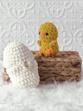 Handmade peek-a-boo chick crochet plushie inside a crochet egg