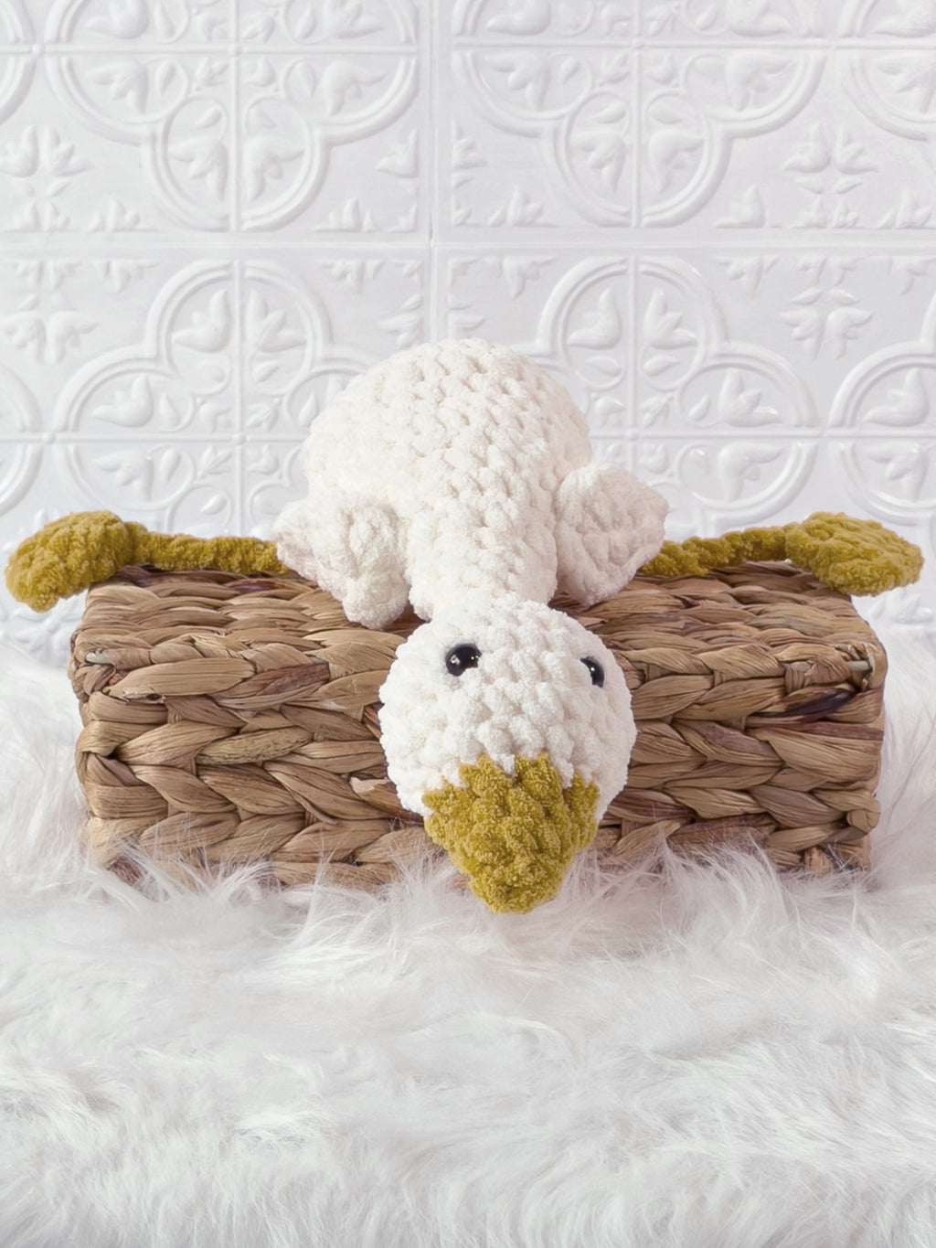 Handmade cream, yellow silly goose crochet plushie shown from the front