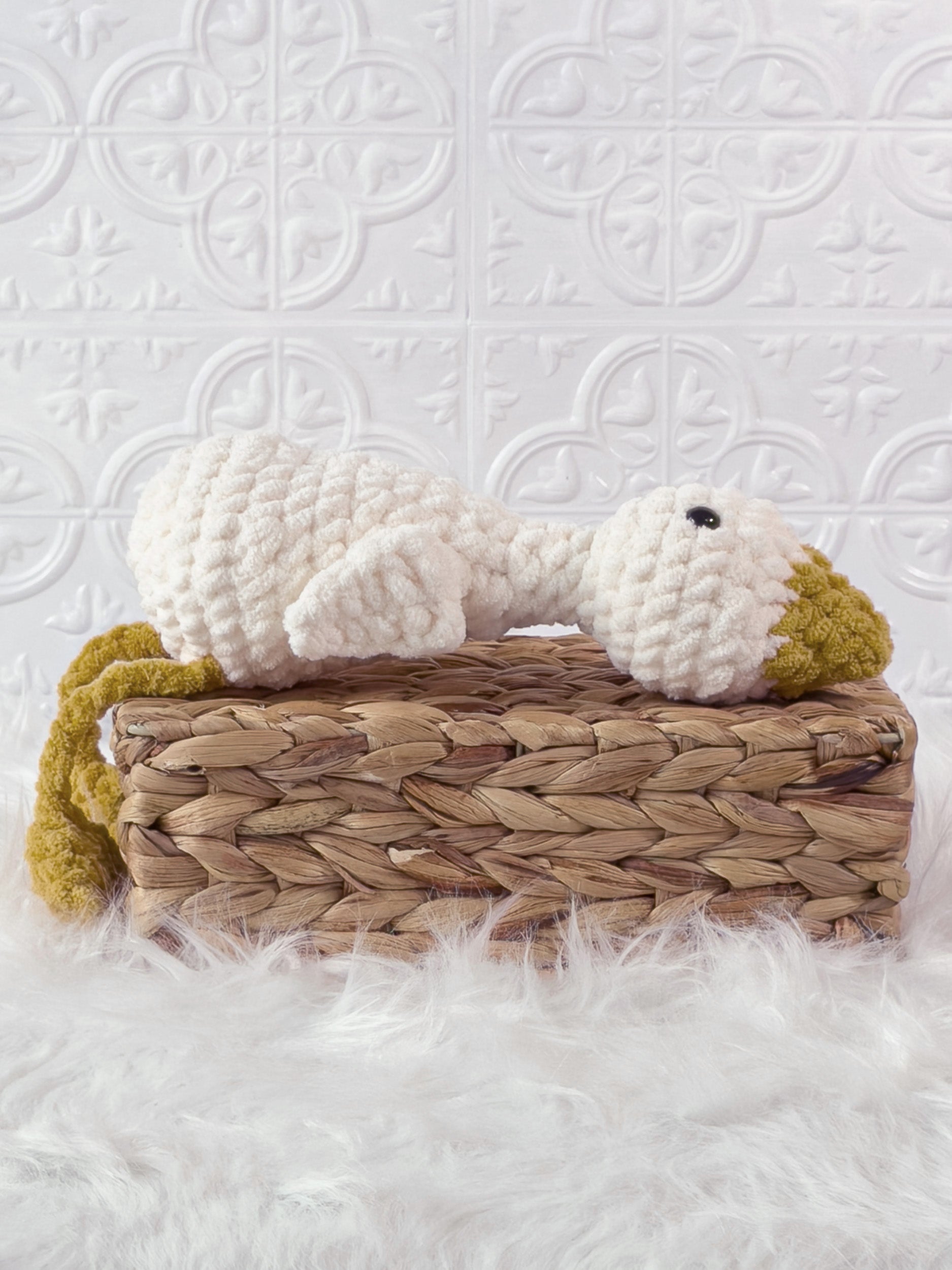 Handmade cream, yellow silly goose crochet plushie shown from the side