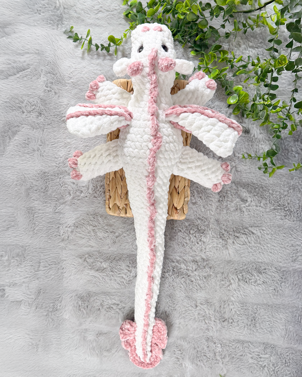 Handmade white dragon crochet plushie shown from the back