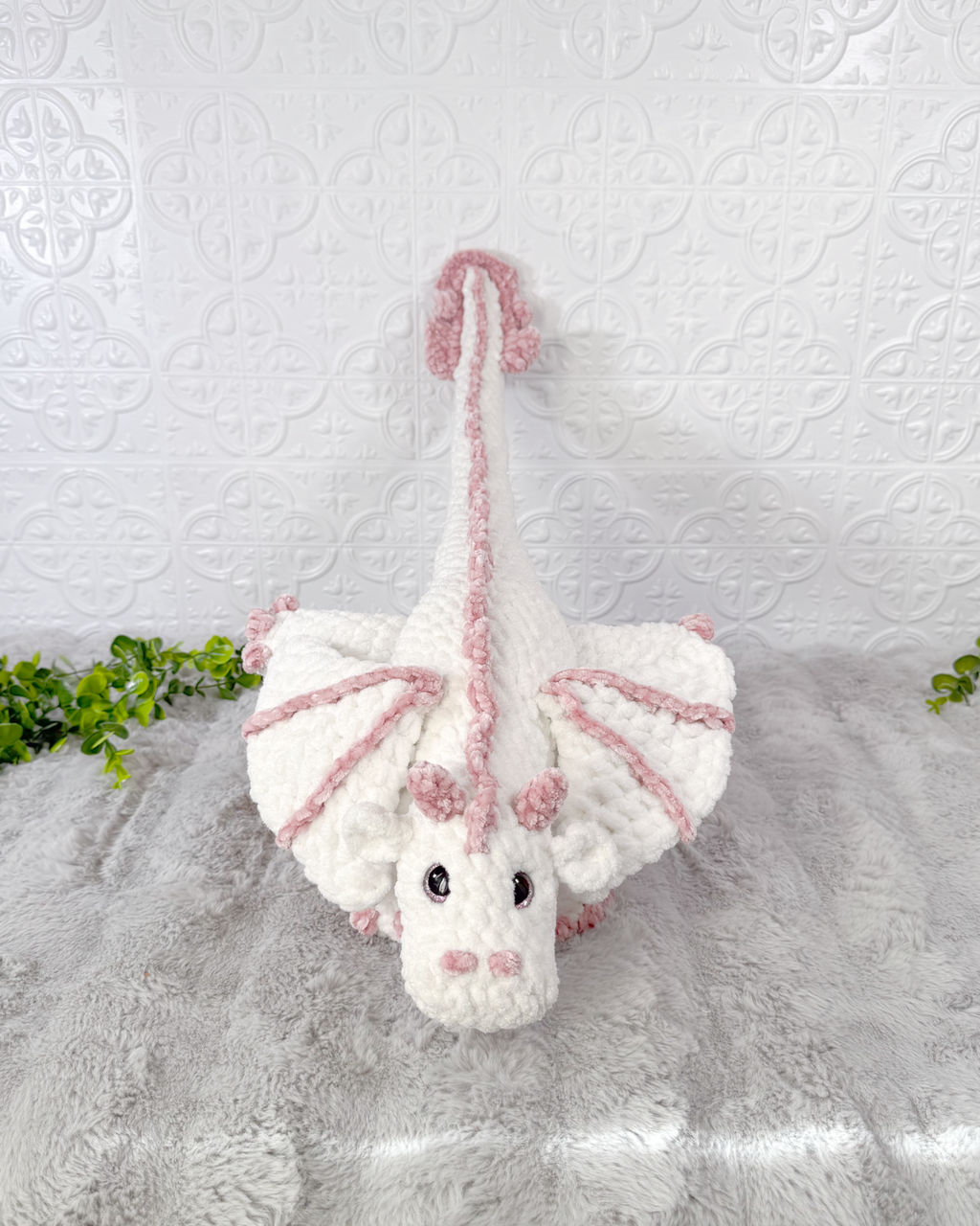 Handmade dragon crochet plushie shown from the front