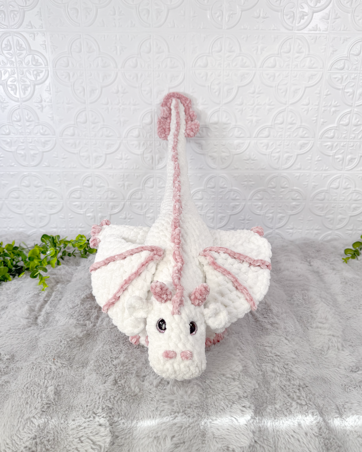 Handmade dragon crochet plushie shown from the front