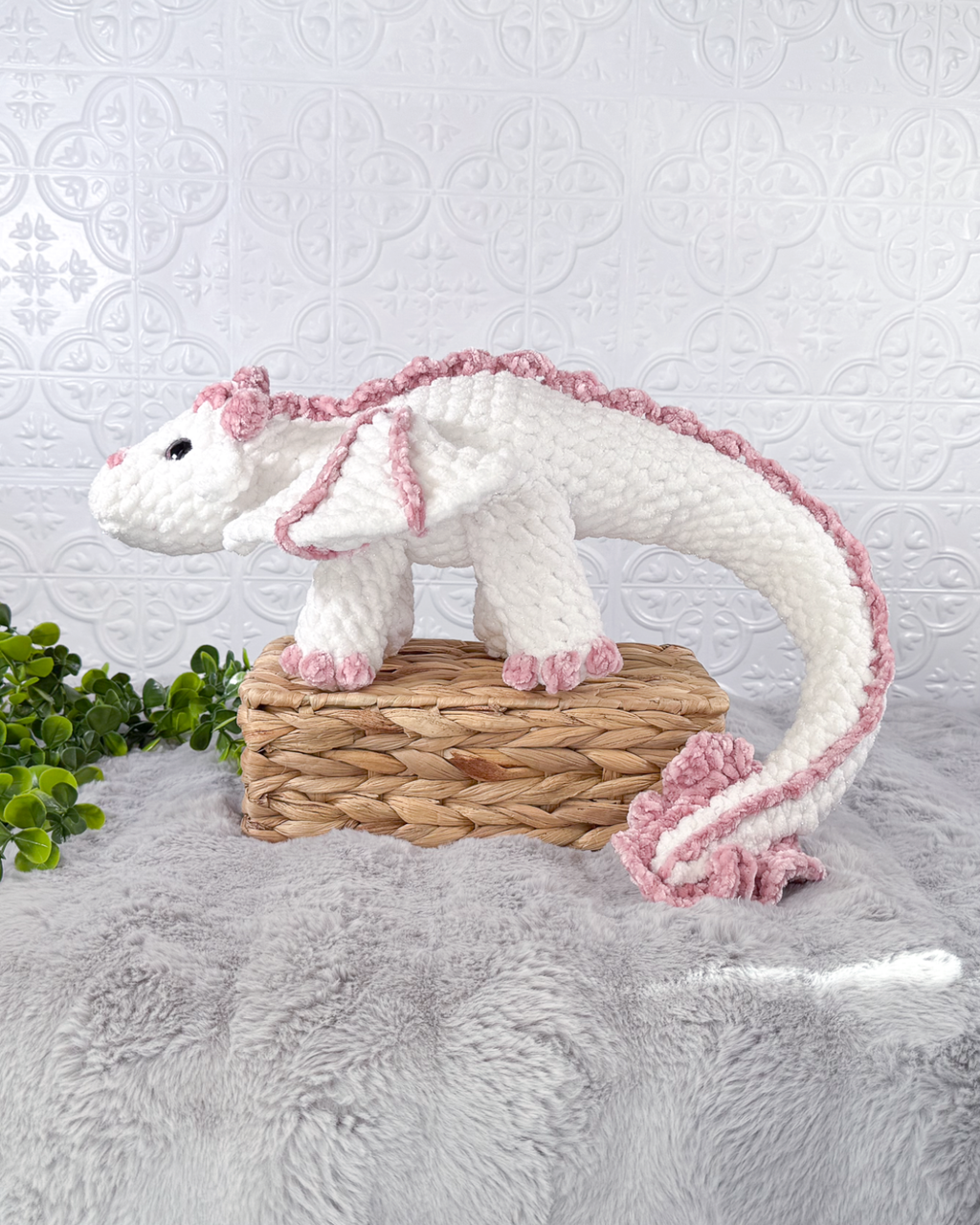 Handmade white dragon crochet plushie shown from the side
