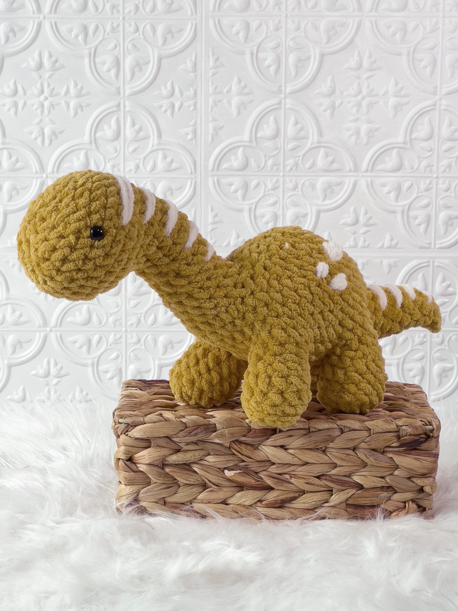 Handmade brachiosaurus crochet plushie shown from the front