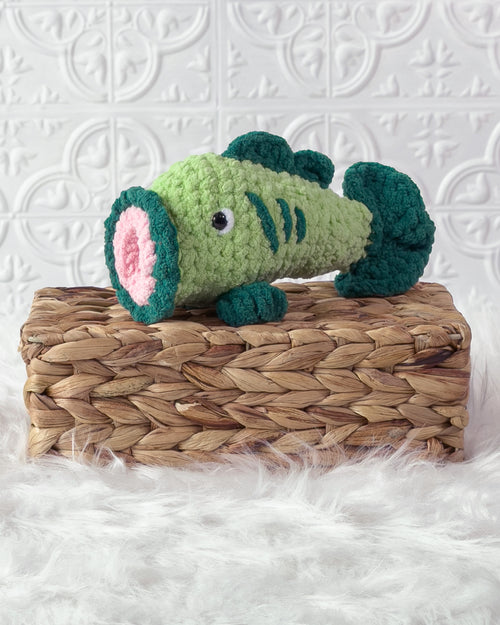 Handmade bass fish crochet plushie shown from the front