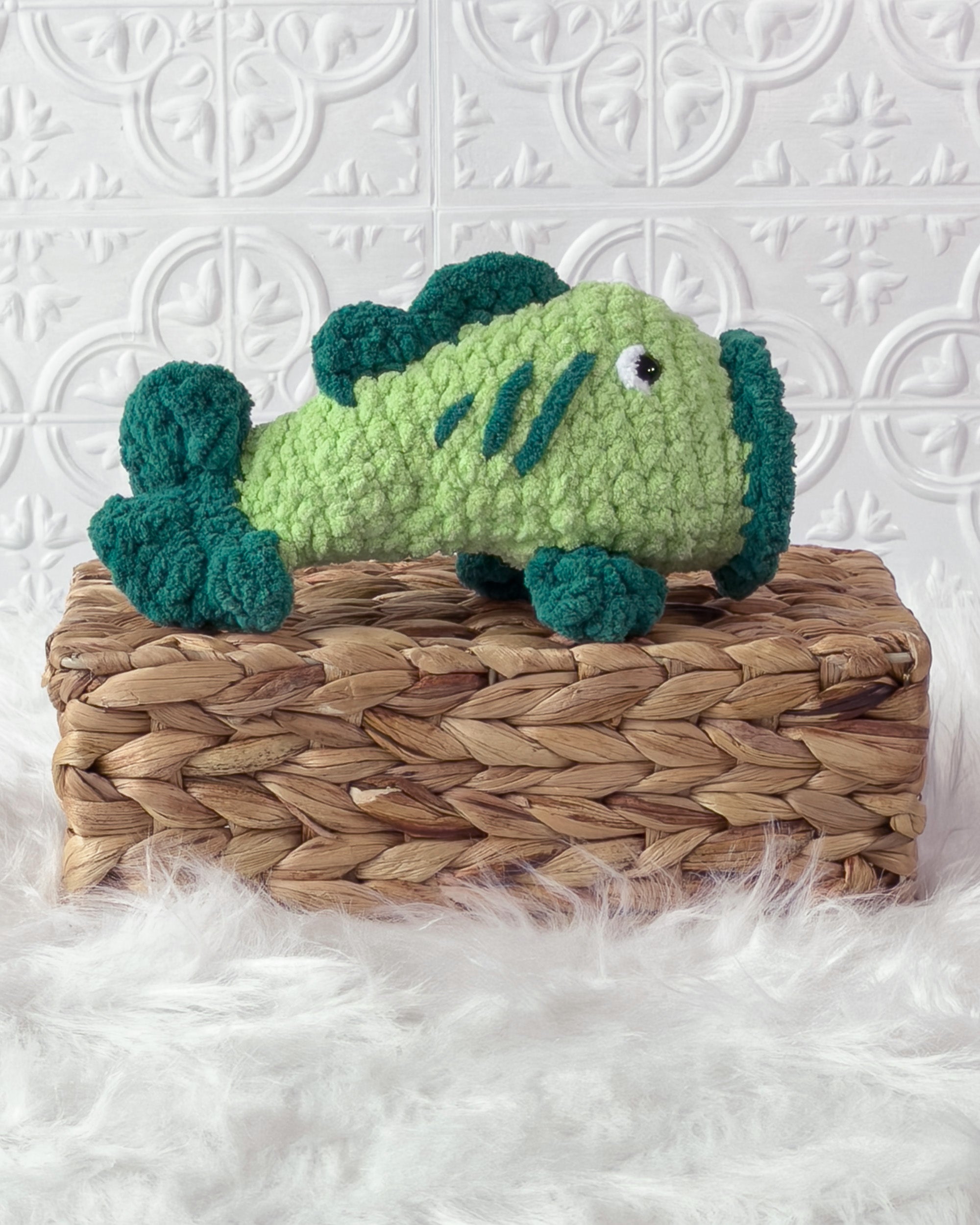 Handmade green bass fish crochet plushie shown from the side