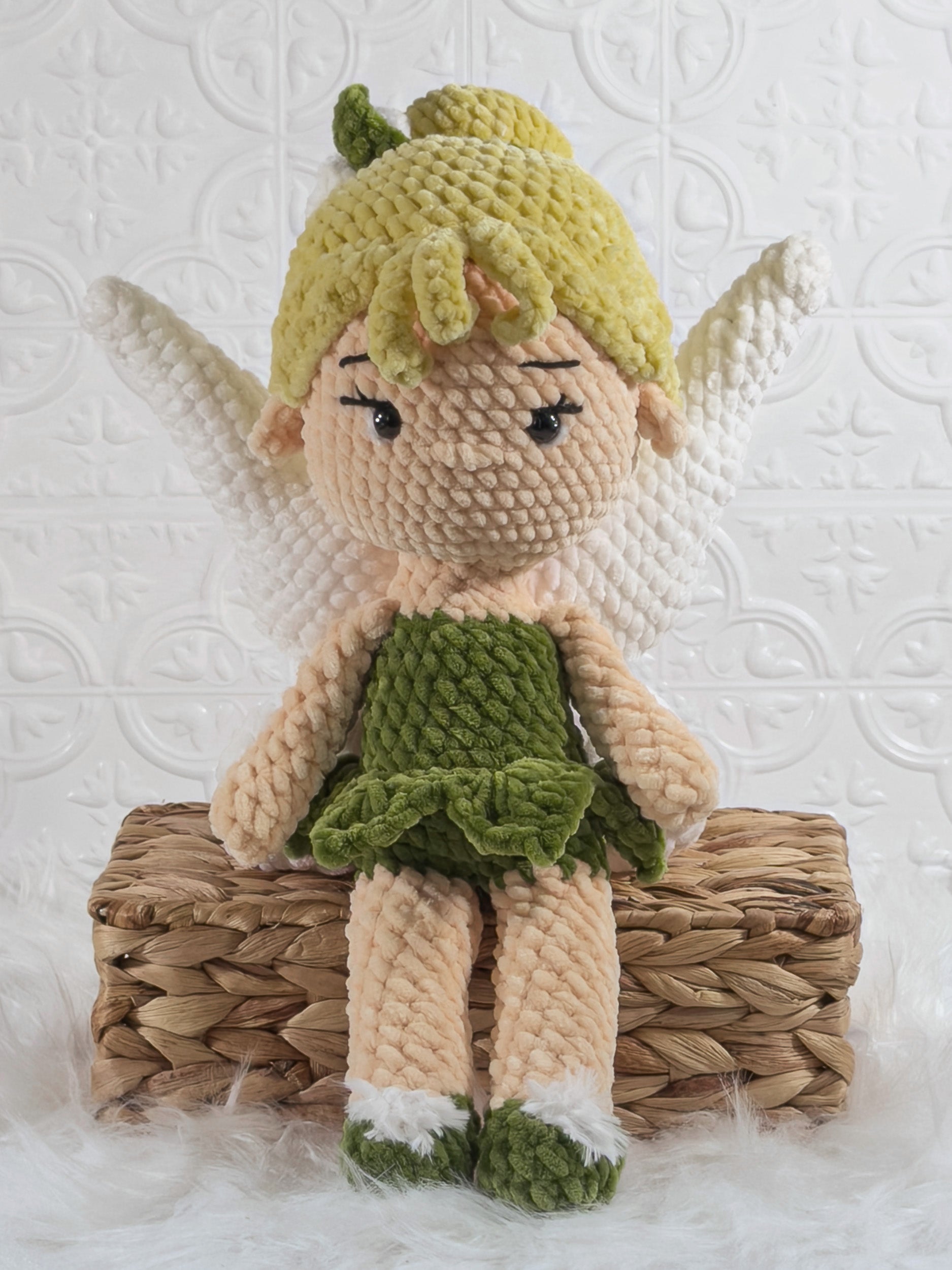 Handmade green fairy crochet plushie shown from the front