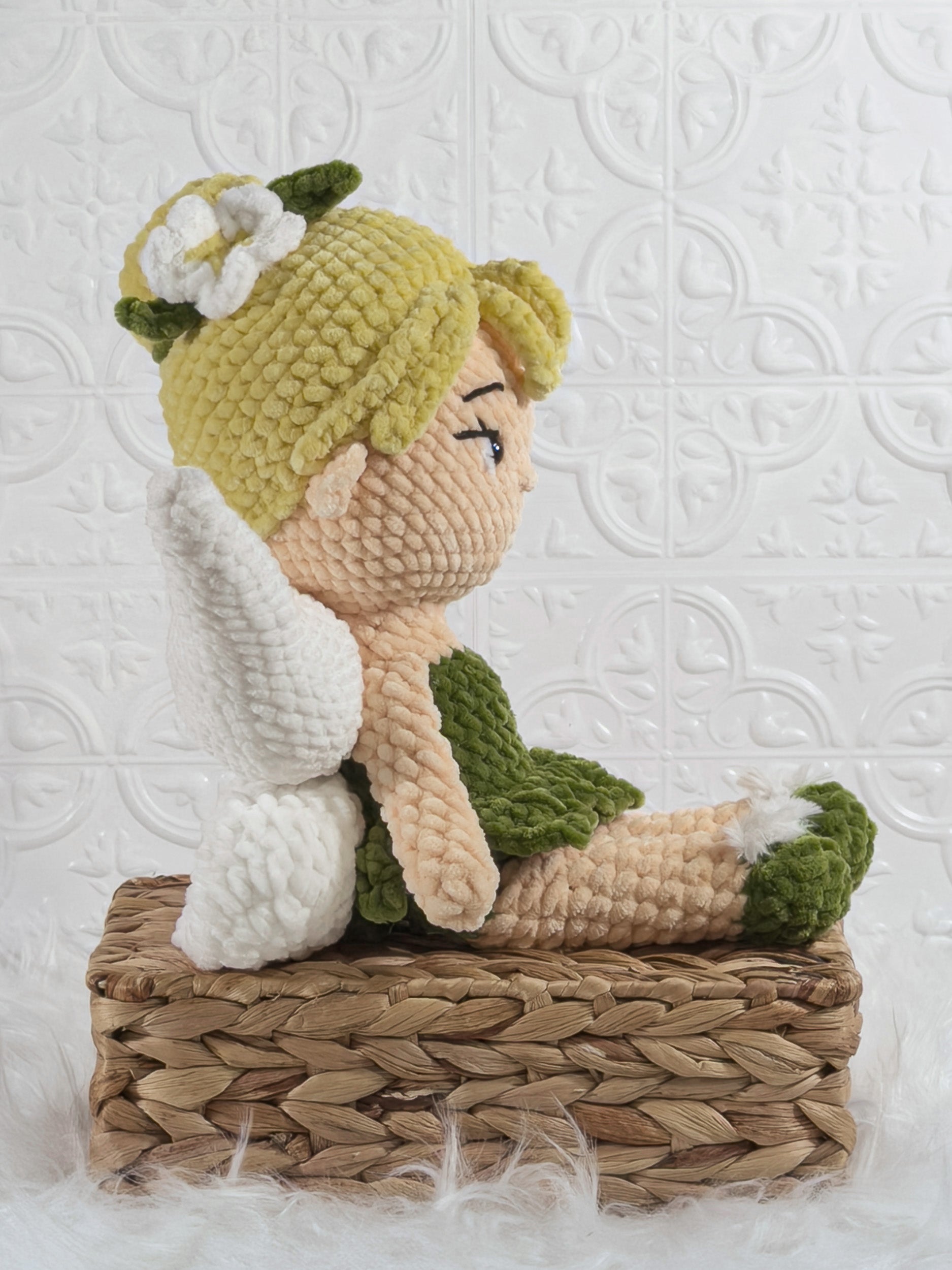 Handmade green fairy crochet plushie shown from the side