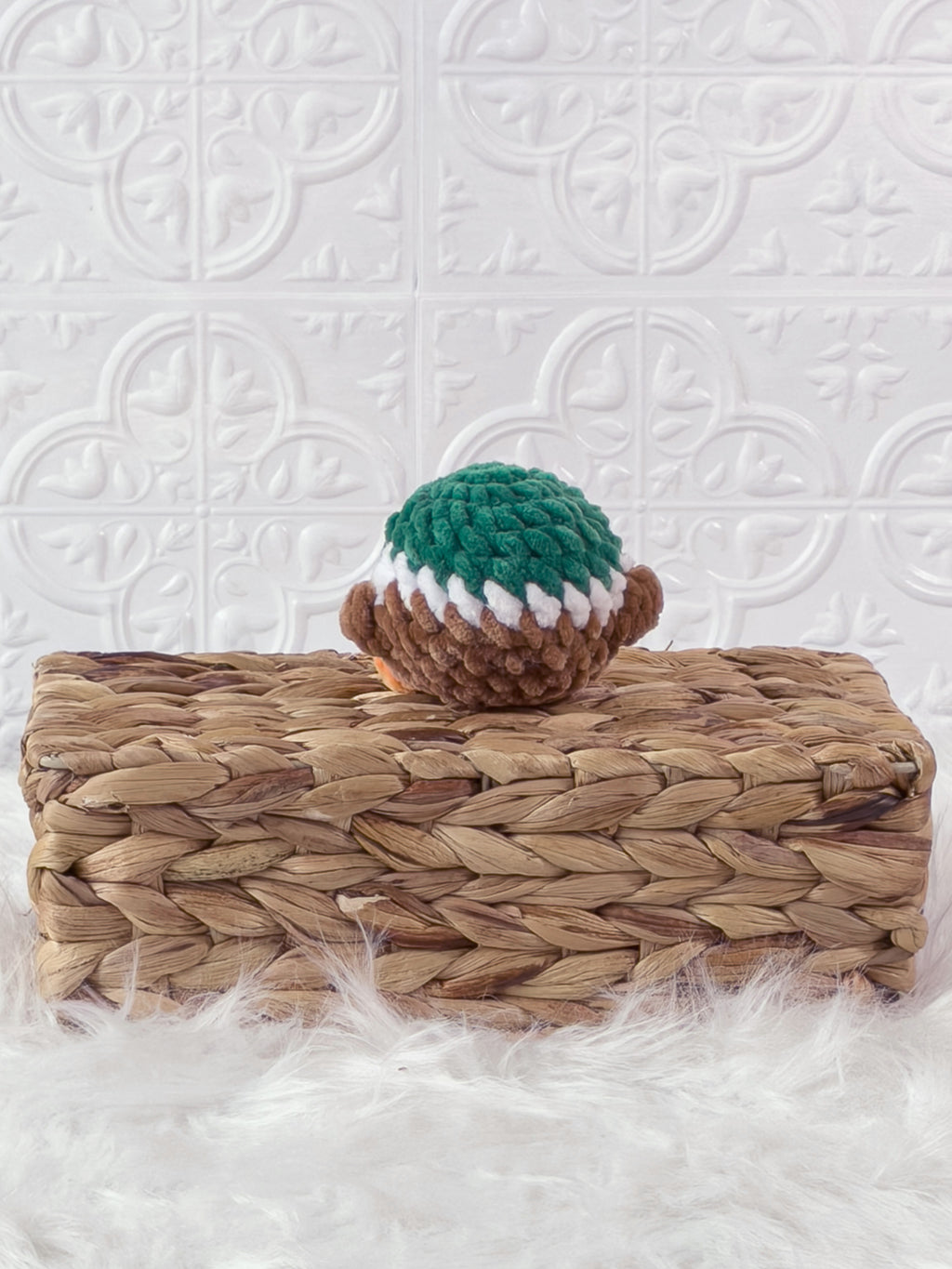 Handmade green mallard crochet plushie shown from the back