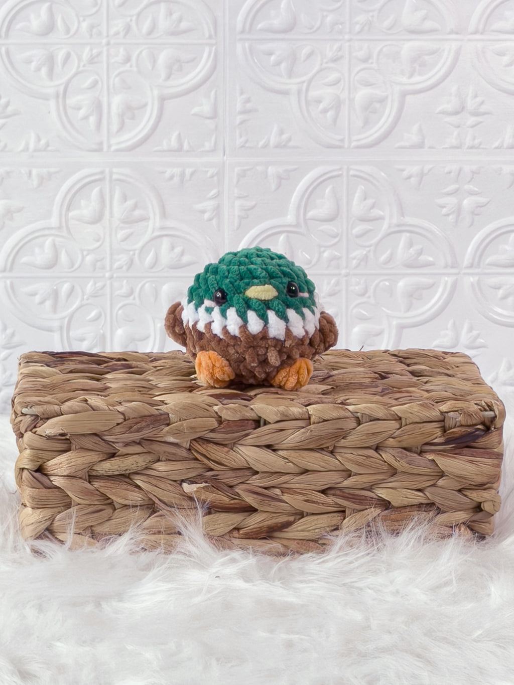 Handmade green mallard crochet plushie shown from the front