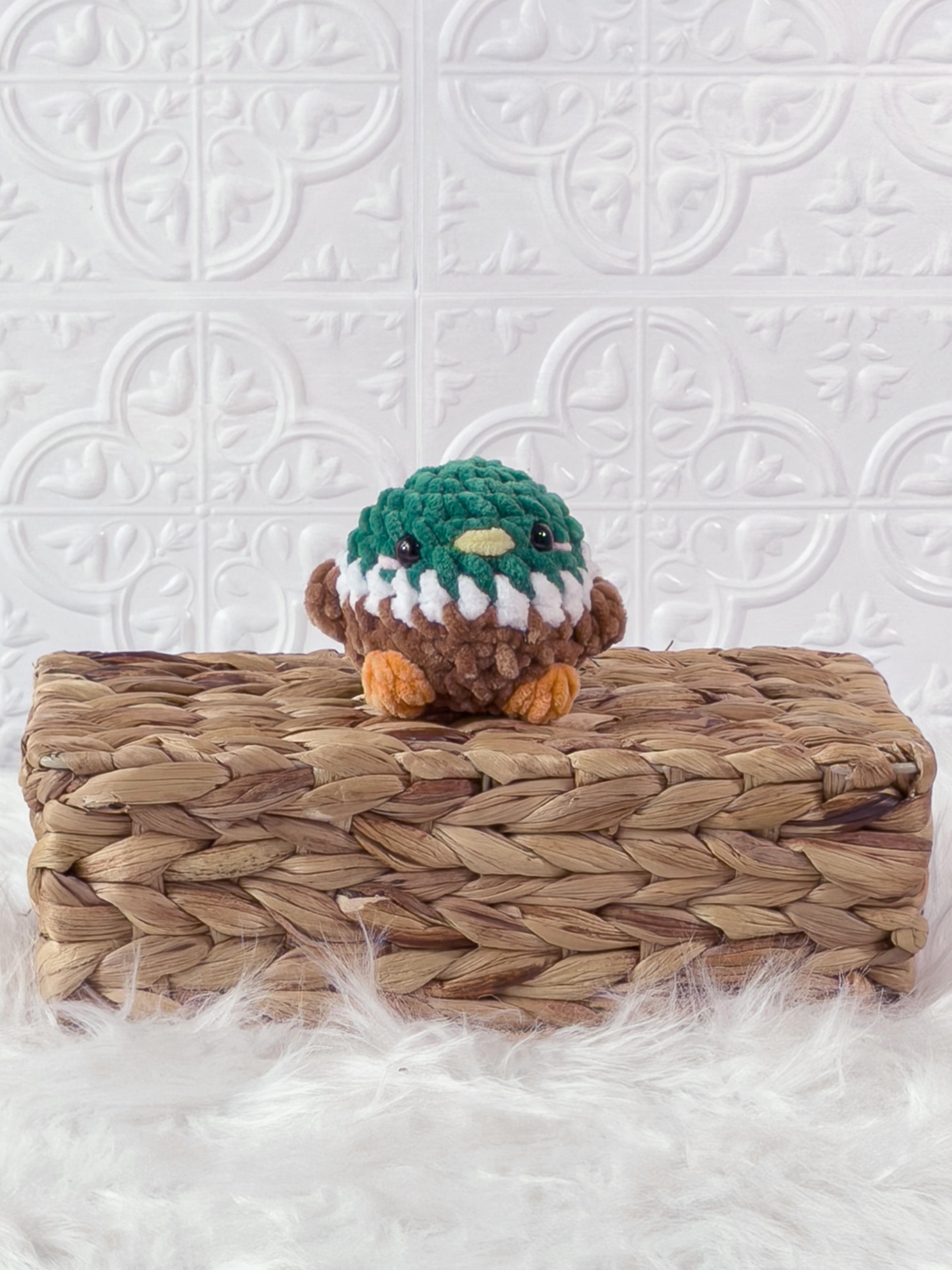 Handmade green mallard crochet plushie shown from the front