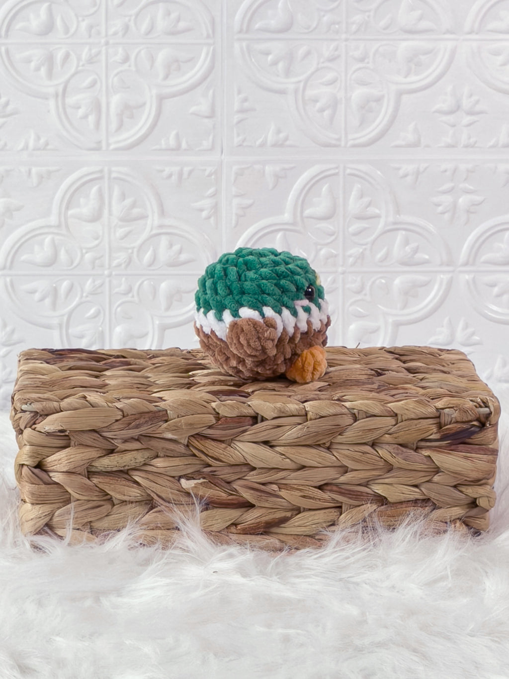 Handmade green mallard crochet plushie shown from the side