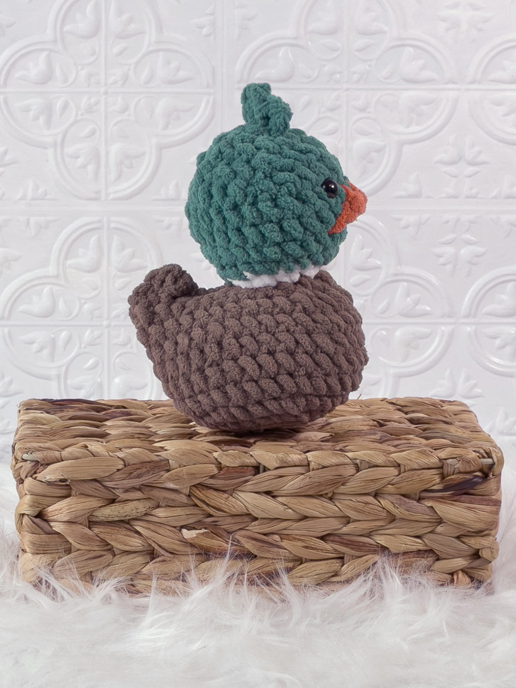 Handmade green mallard rubber duck crochet plushie shown from the side