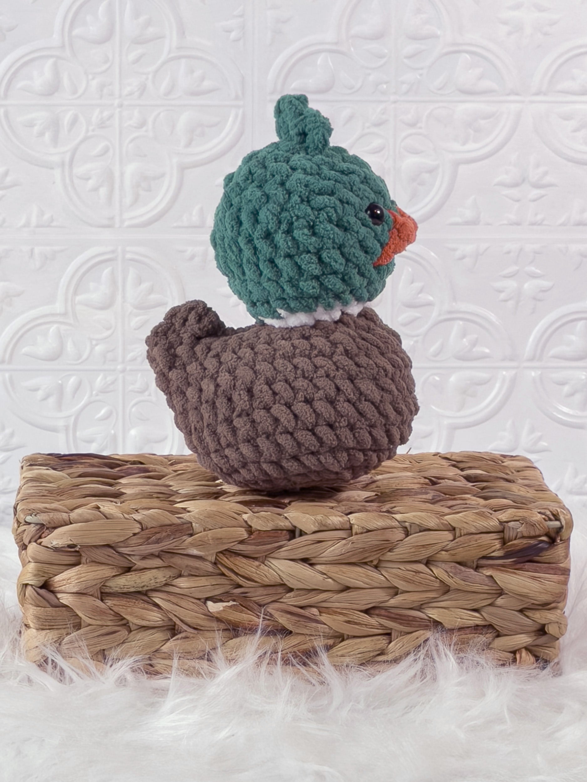 Handmade green mallard rubber duck crochet plushie shown from the side