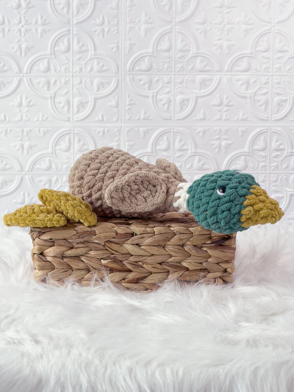 Handmade green silly mallard crochet plushie shown from an angled view