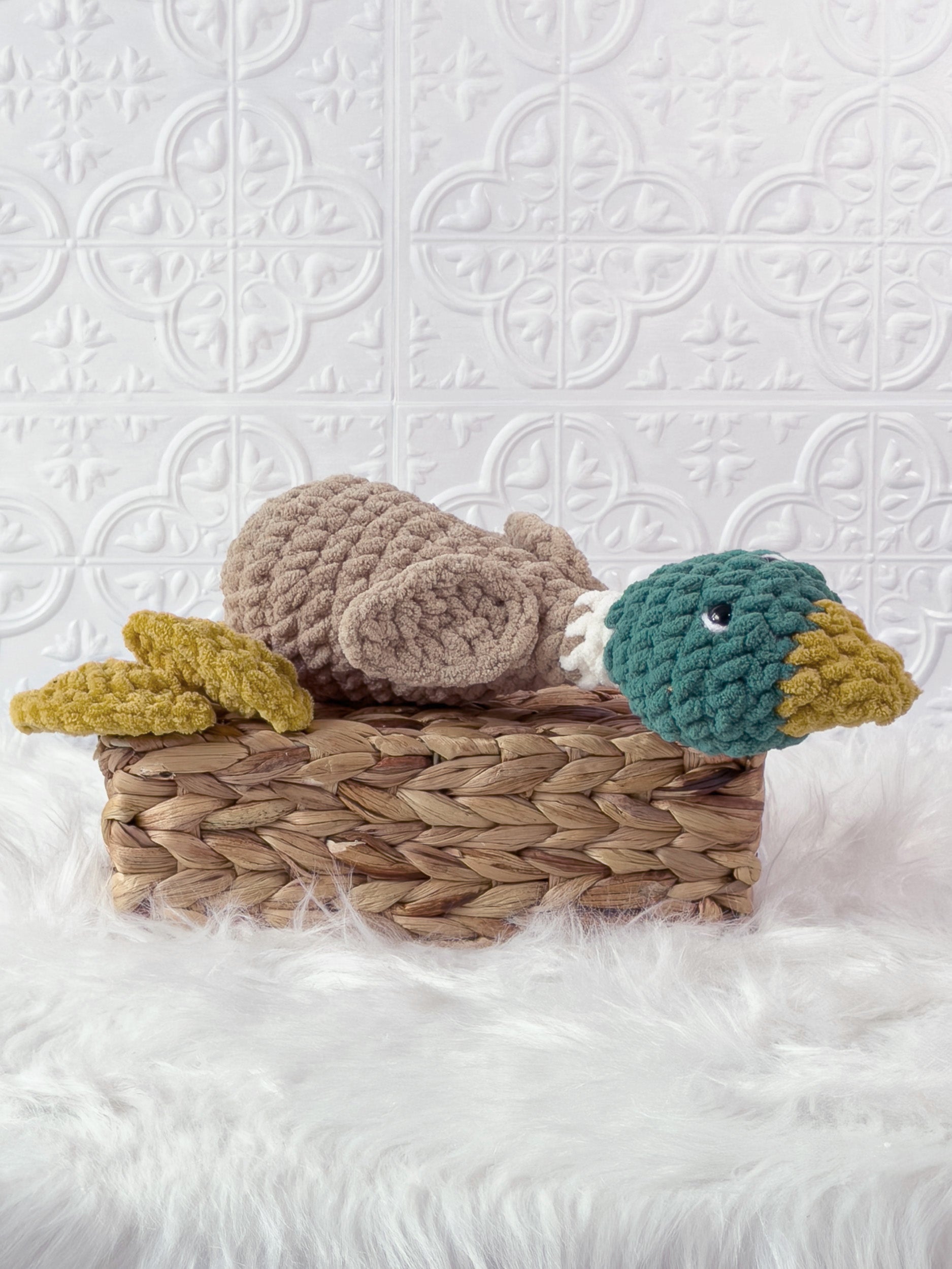 Handmade green silly mallard crochet plushie shown from an angled view