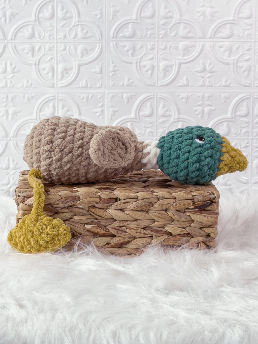 Handmade green silly mallard crochet plushie shown from the side
