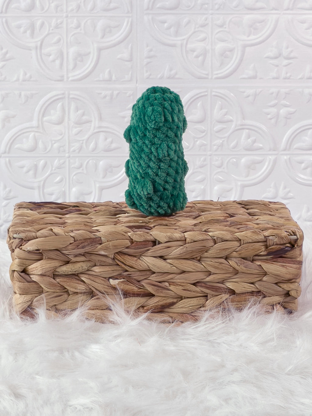 Handmade green, dark dill pickle crochet plushie shown from the back