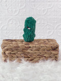 Handmade dill pickle crochet plushie with a playful food-inspired shape
