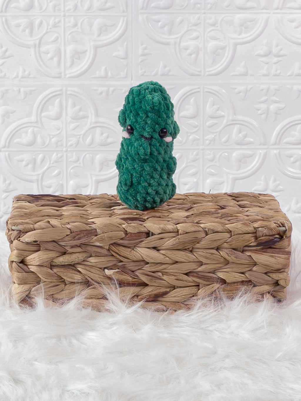 Handmade green, dark dill pickle crochet plushie shown from the front