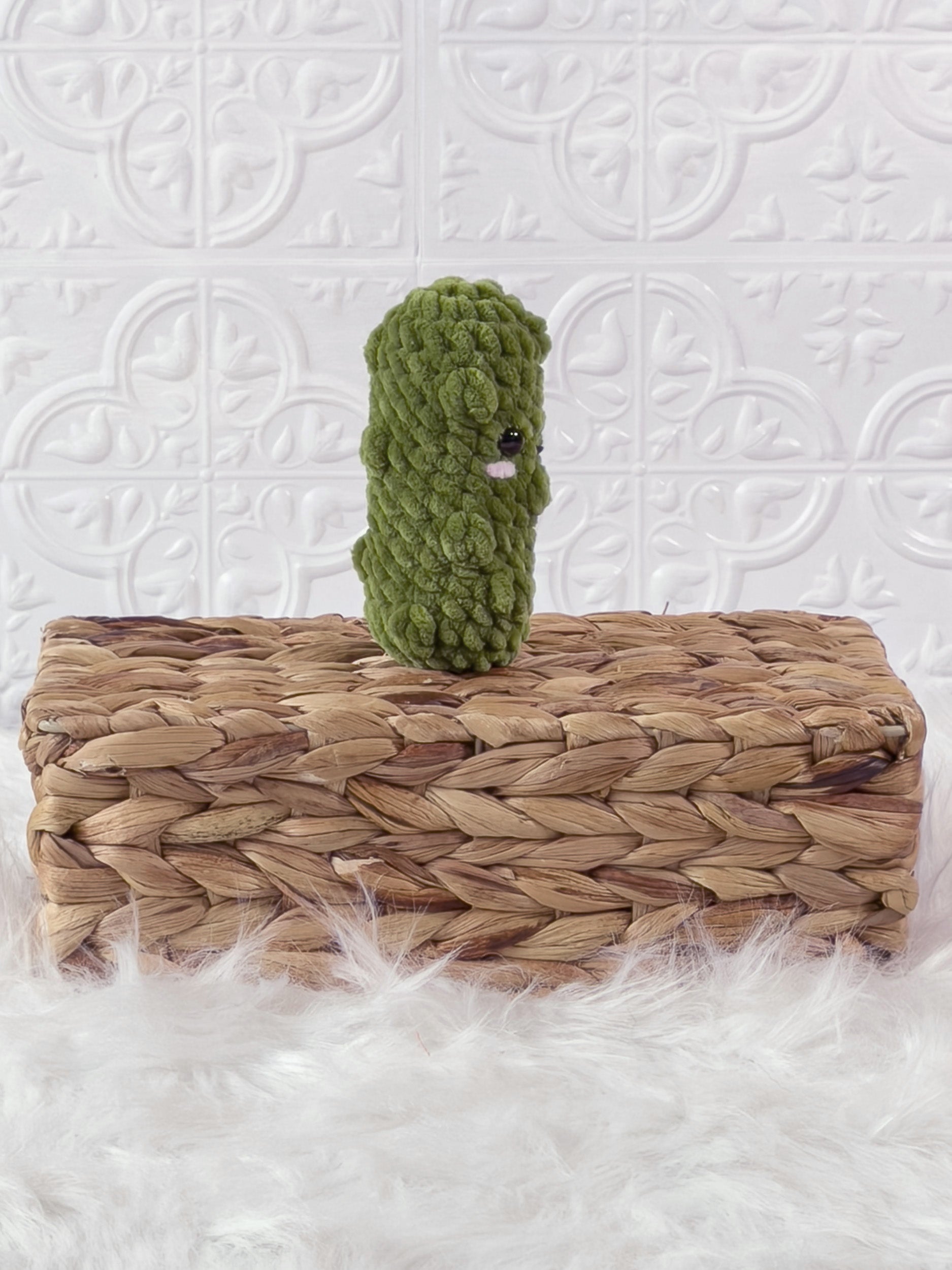 Handmade green, light dill pickle crochet plushie shown from the back