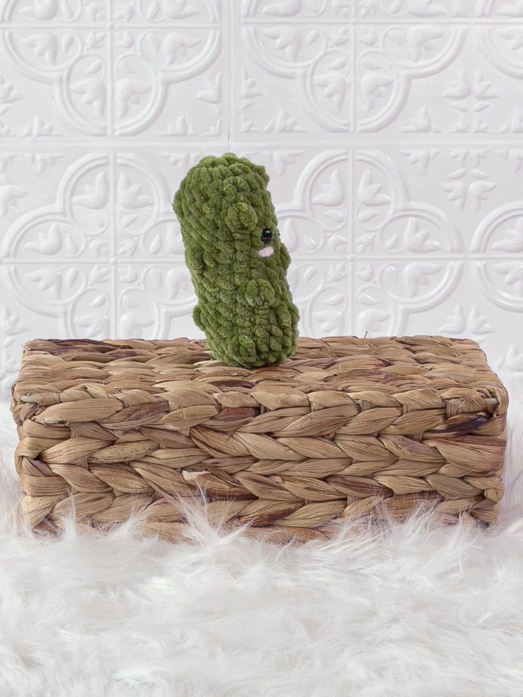 Handmade green, light dill pickle crochet plushie shown from the side