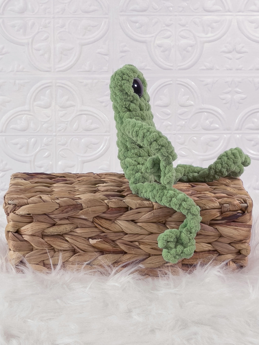Handmade green, light leggy froggy crochet plushie shown from the side