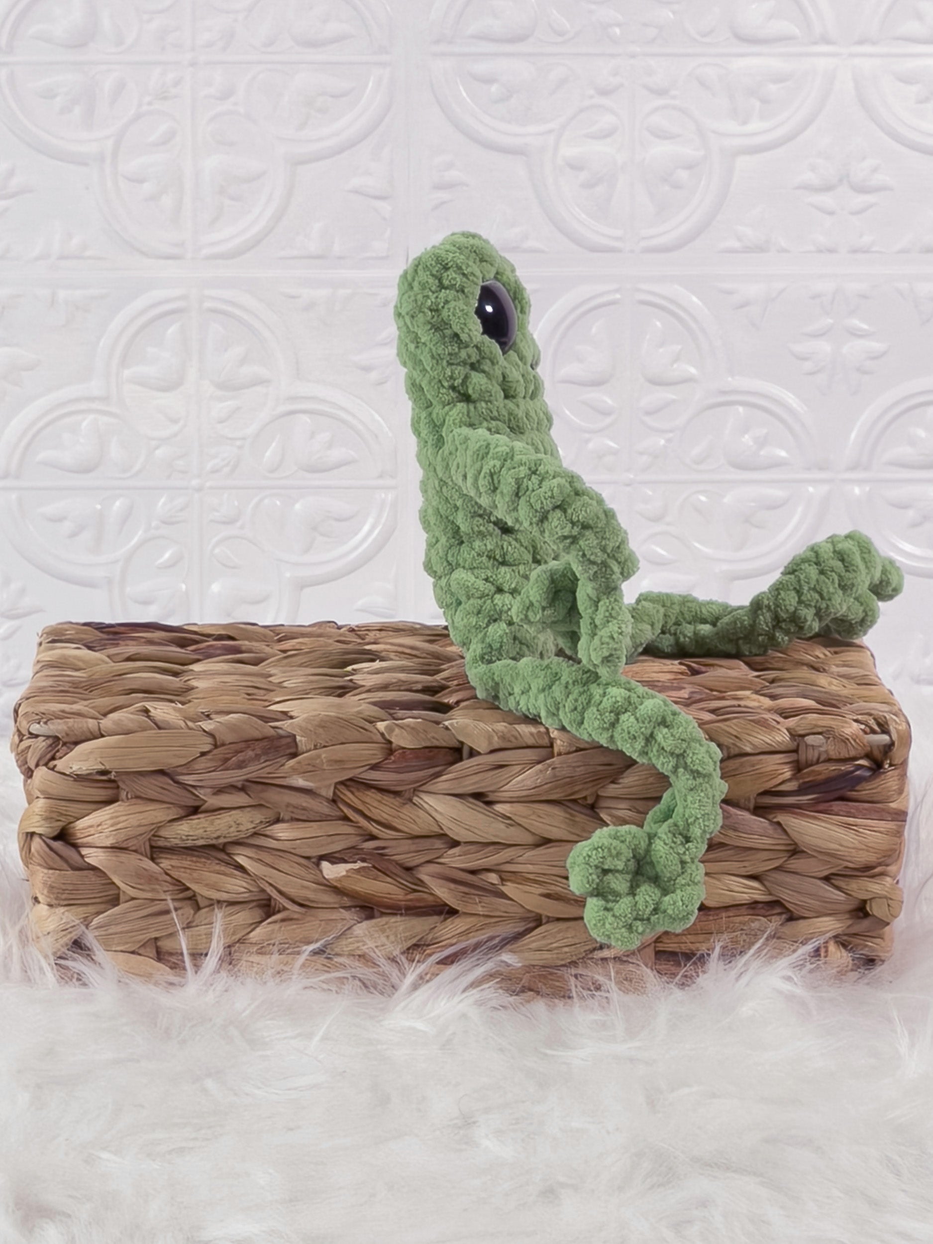Handmade green, light leggy froggy crochet plushie shown from the side