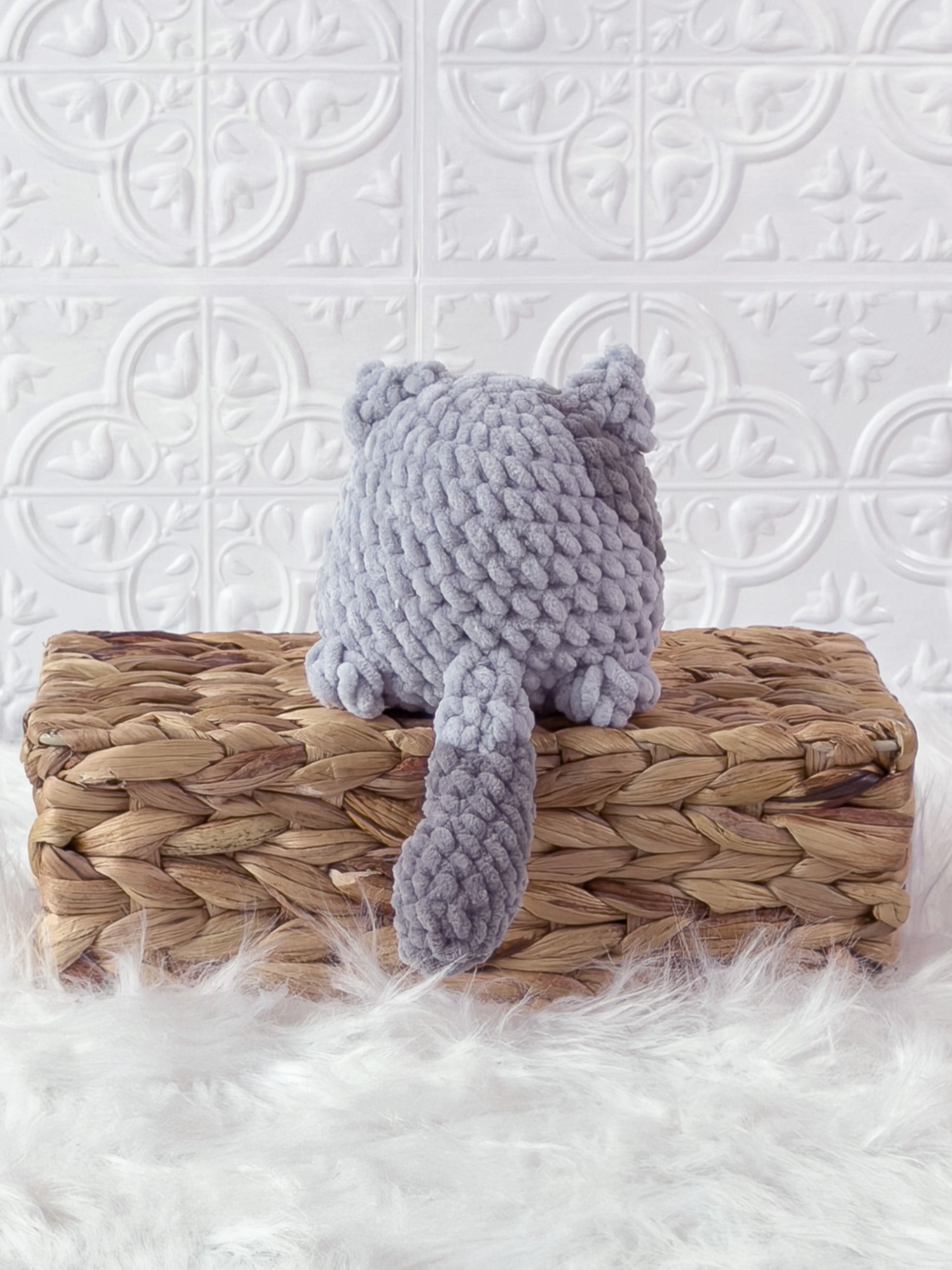 Handmade grey kitten crochet plushie shown from the back
