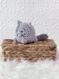 Handmade kitten crochet plushie shown from the front
