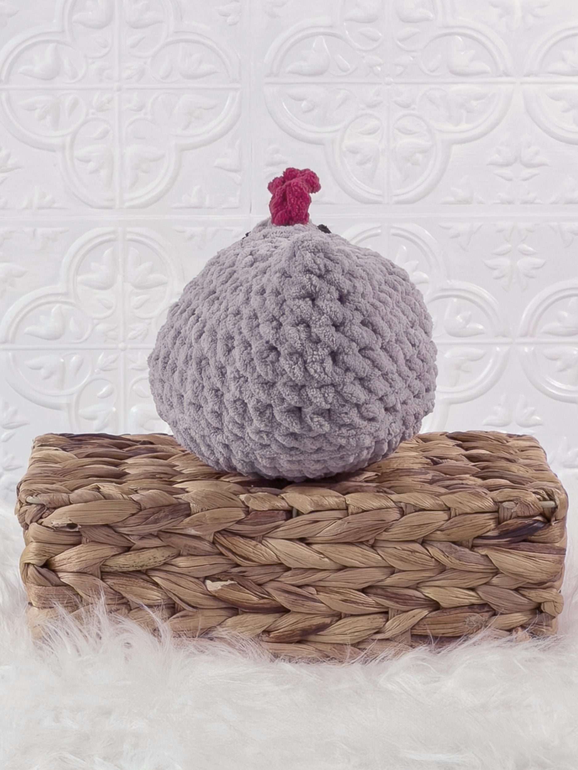 Handmade grey chicken crochet plushie shown from the back