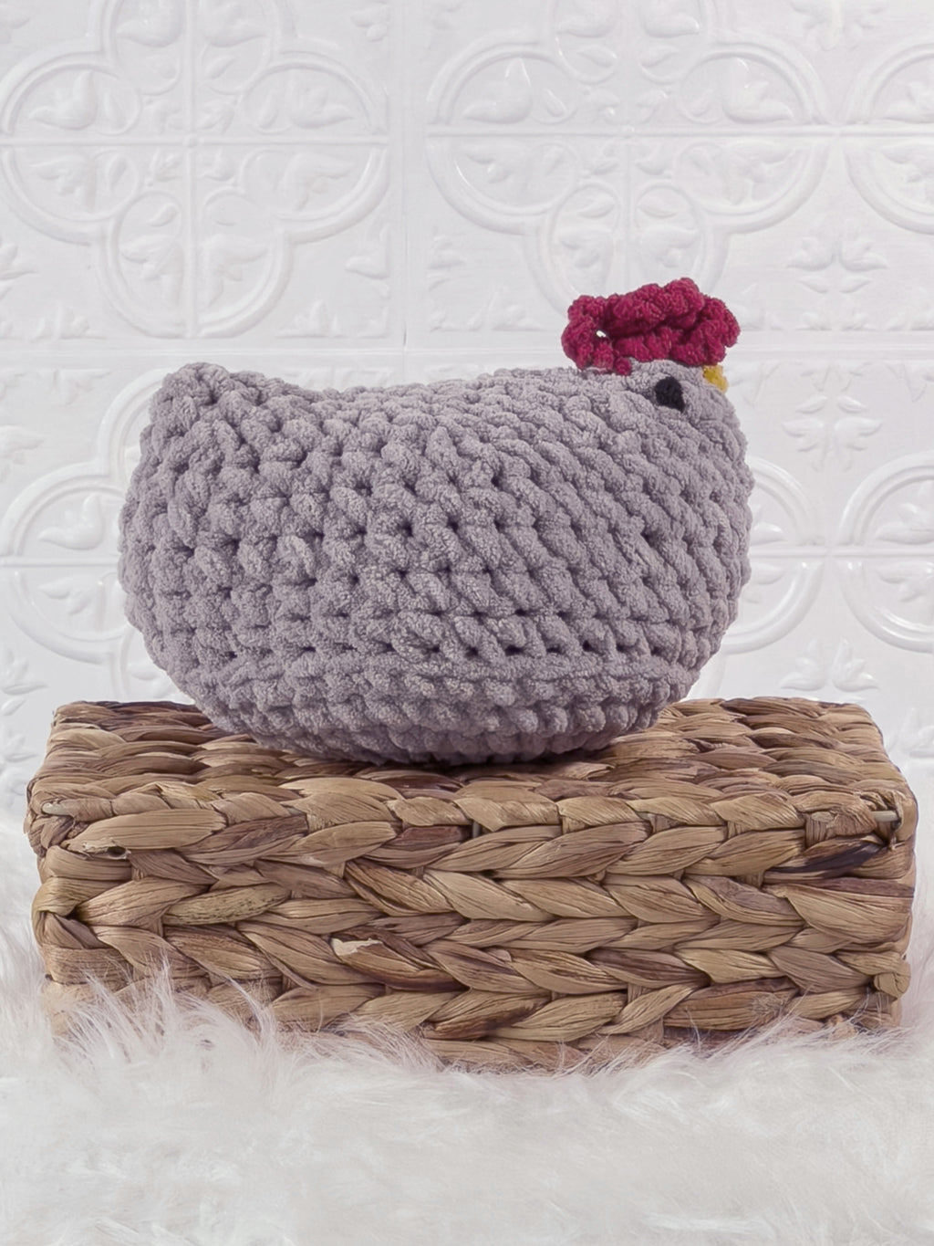 Handmade grey chicken crochet plushie shown from the side