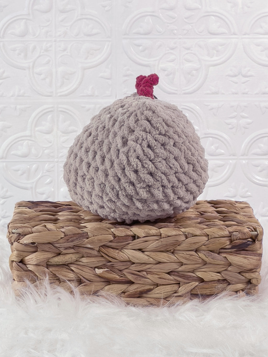 Handmade grey chicken crochet plushie shown from the back