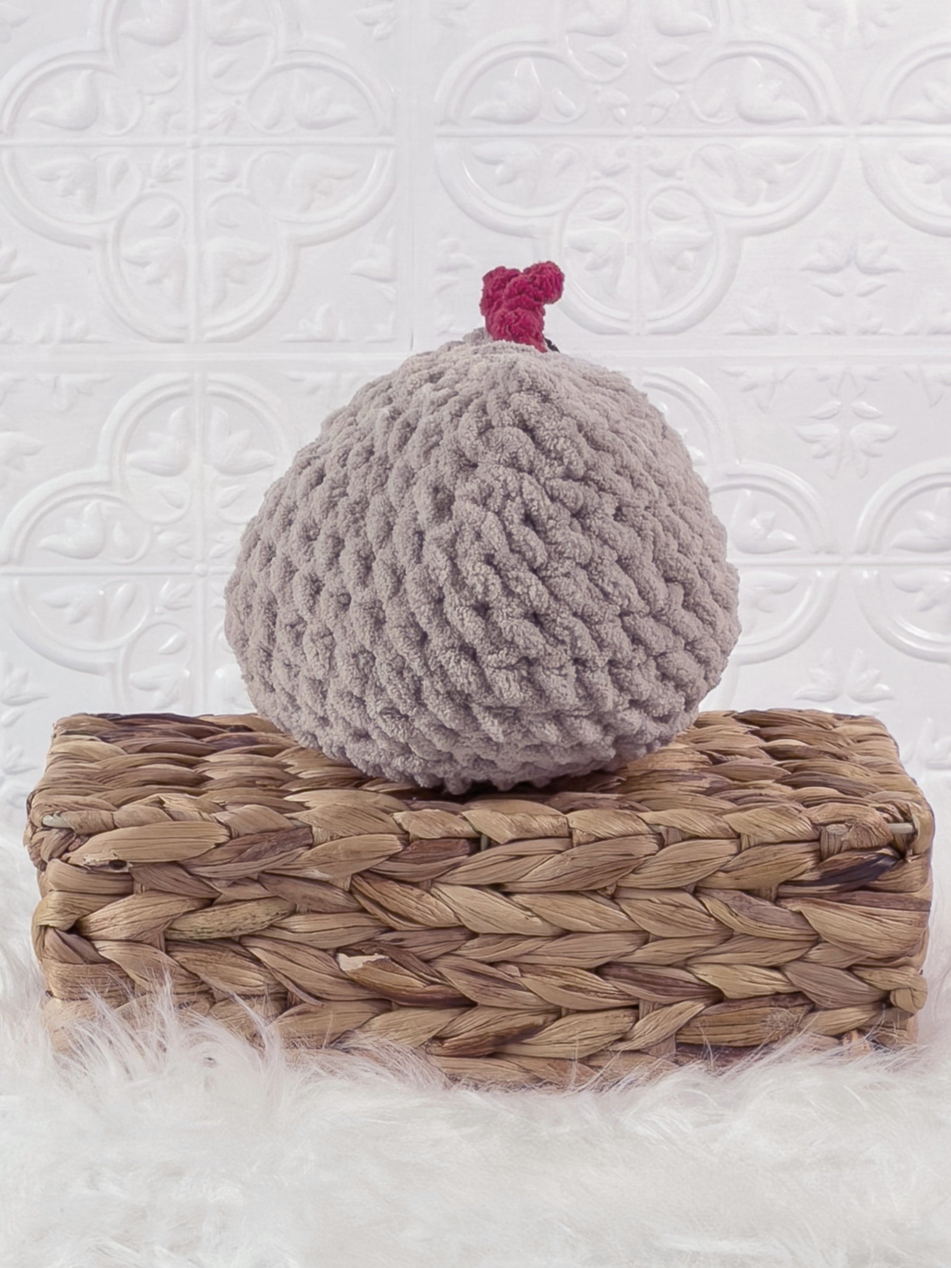 Handmade grey chicken crochet plushie shown from the back