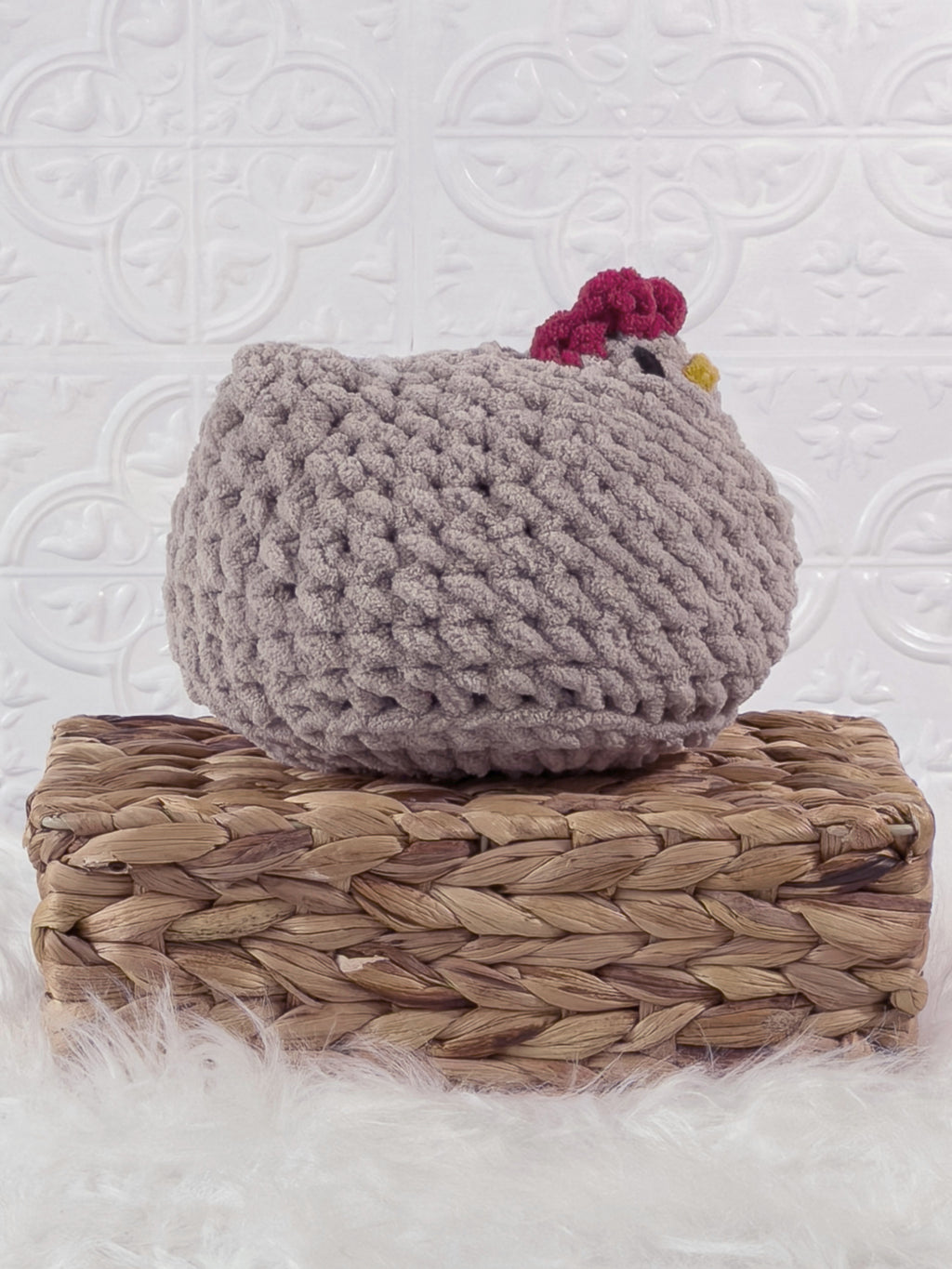 Handmade grey chicken crochet plushie shown from the side
