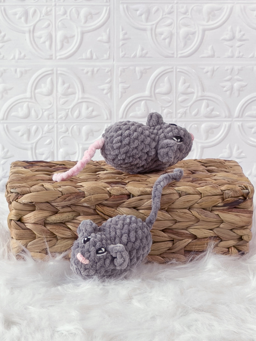 Handmade grey marnie the mouse crochet plushie shown from the back
