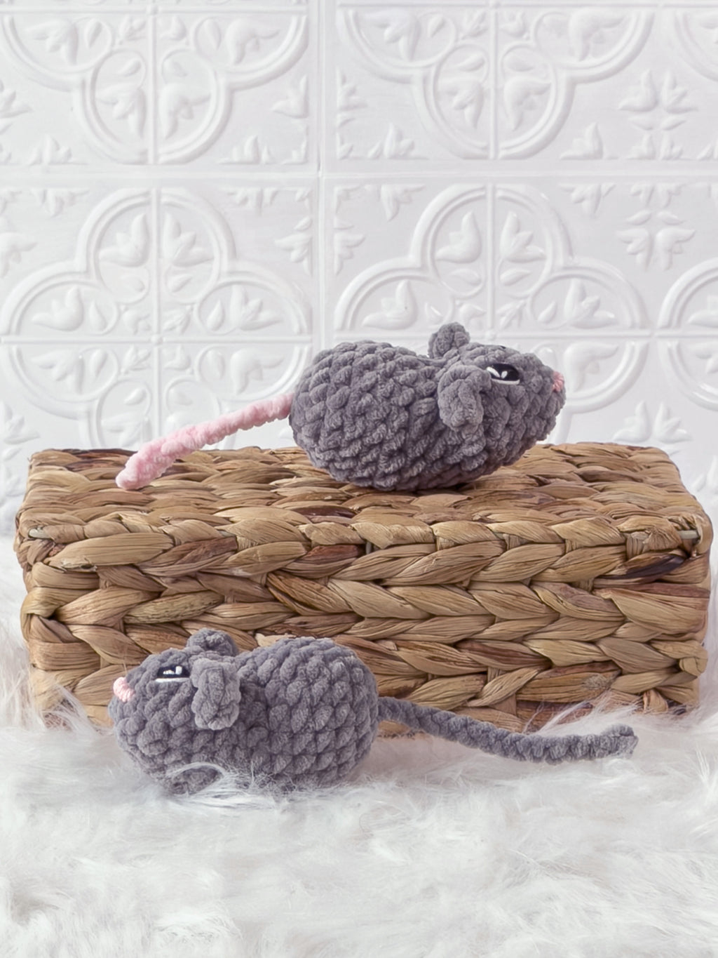 Handmade grey marnie the mouse crochet plushie shown from the side