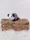Handmade opossum crochet plushie shown from the front