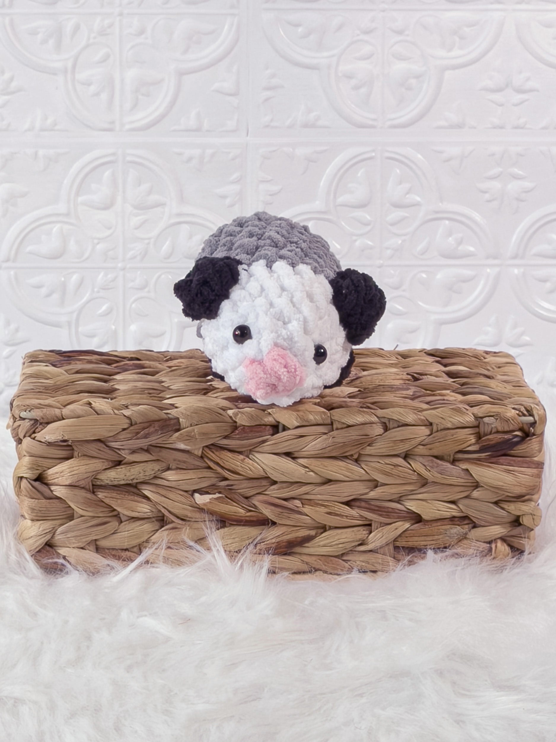 Handmade grey opossum crochet plushie shown from the front