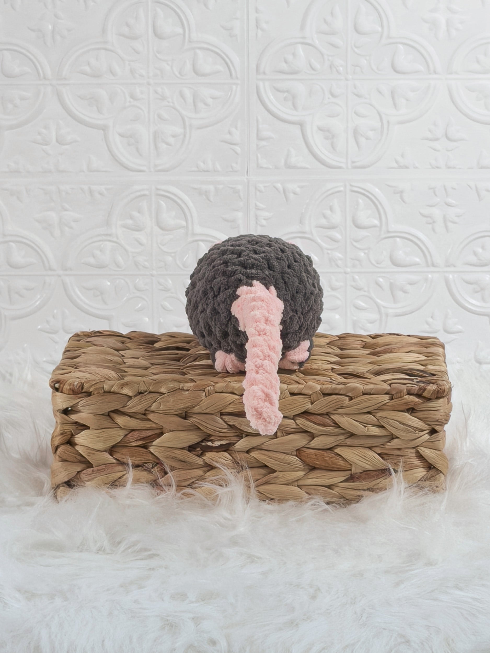 Handmade grey rat crochet plushie shown from the back