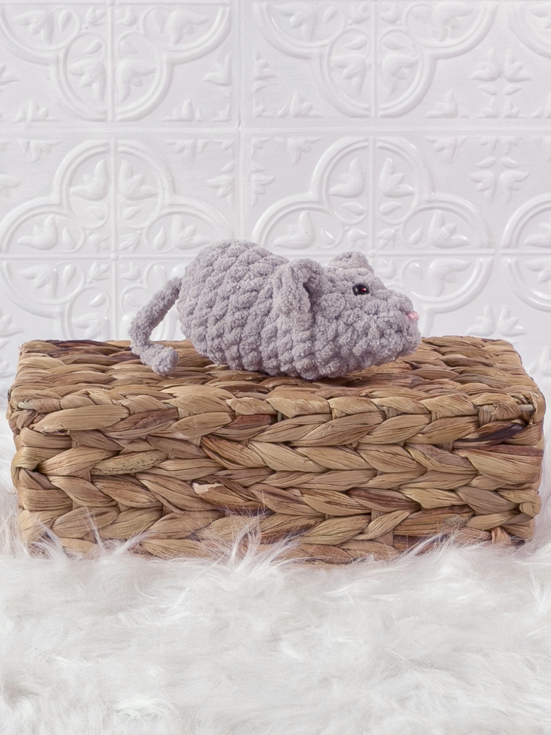 Handmade grey, light mouse crochet plushie shown from an angled view