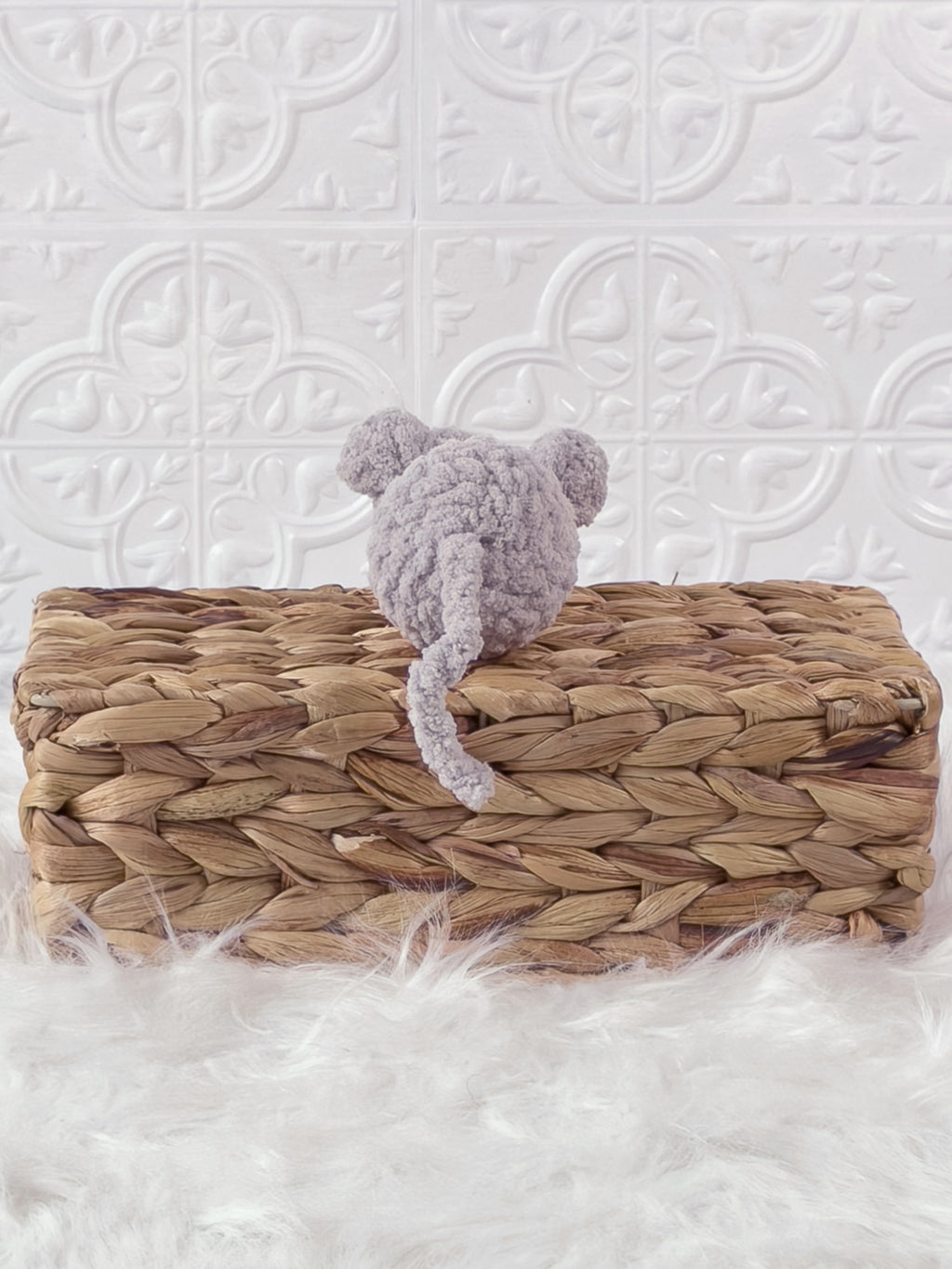 Handmade grey, light mouse crochet plushie shown from the back