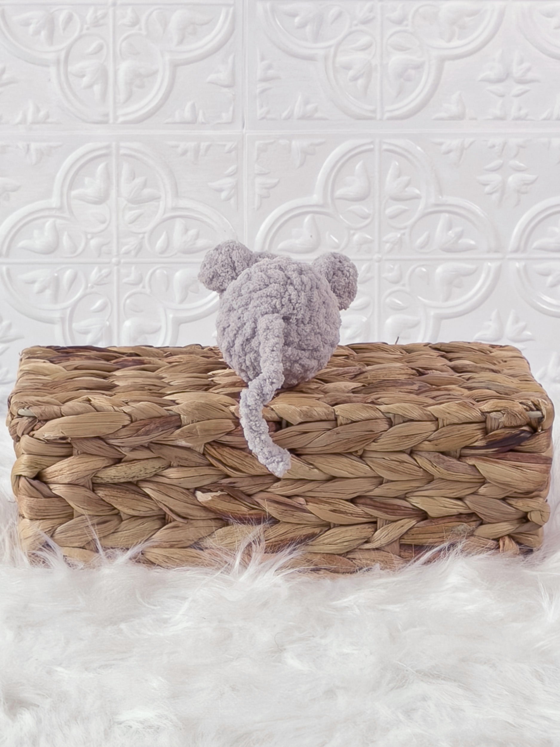 Handmade grey, light mouse crochet plushie shown from the back