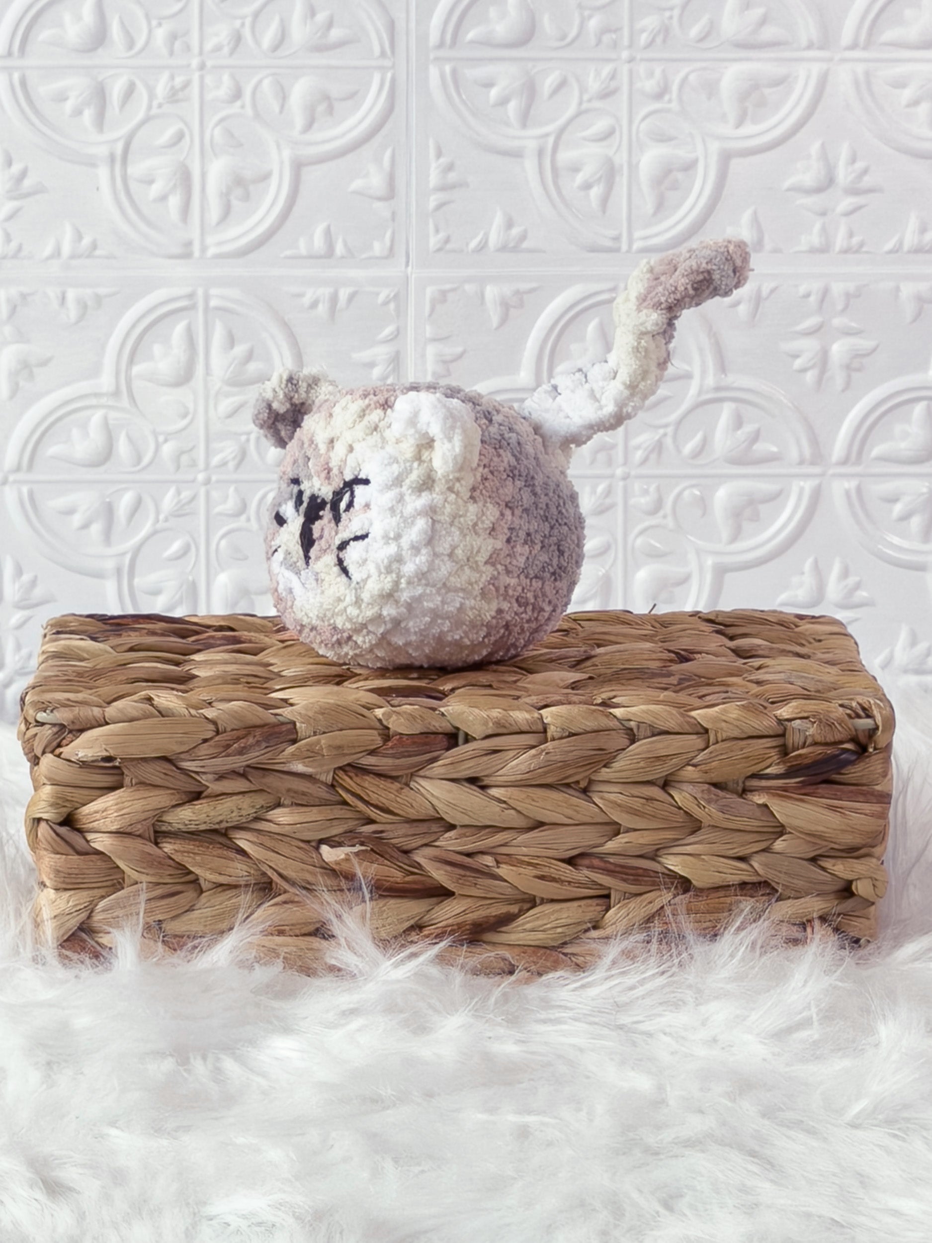 Handmade angry cat crochet plushie shown from the front