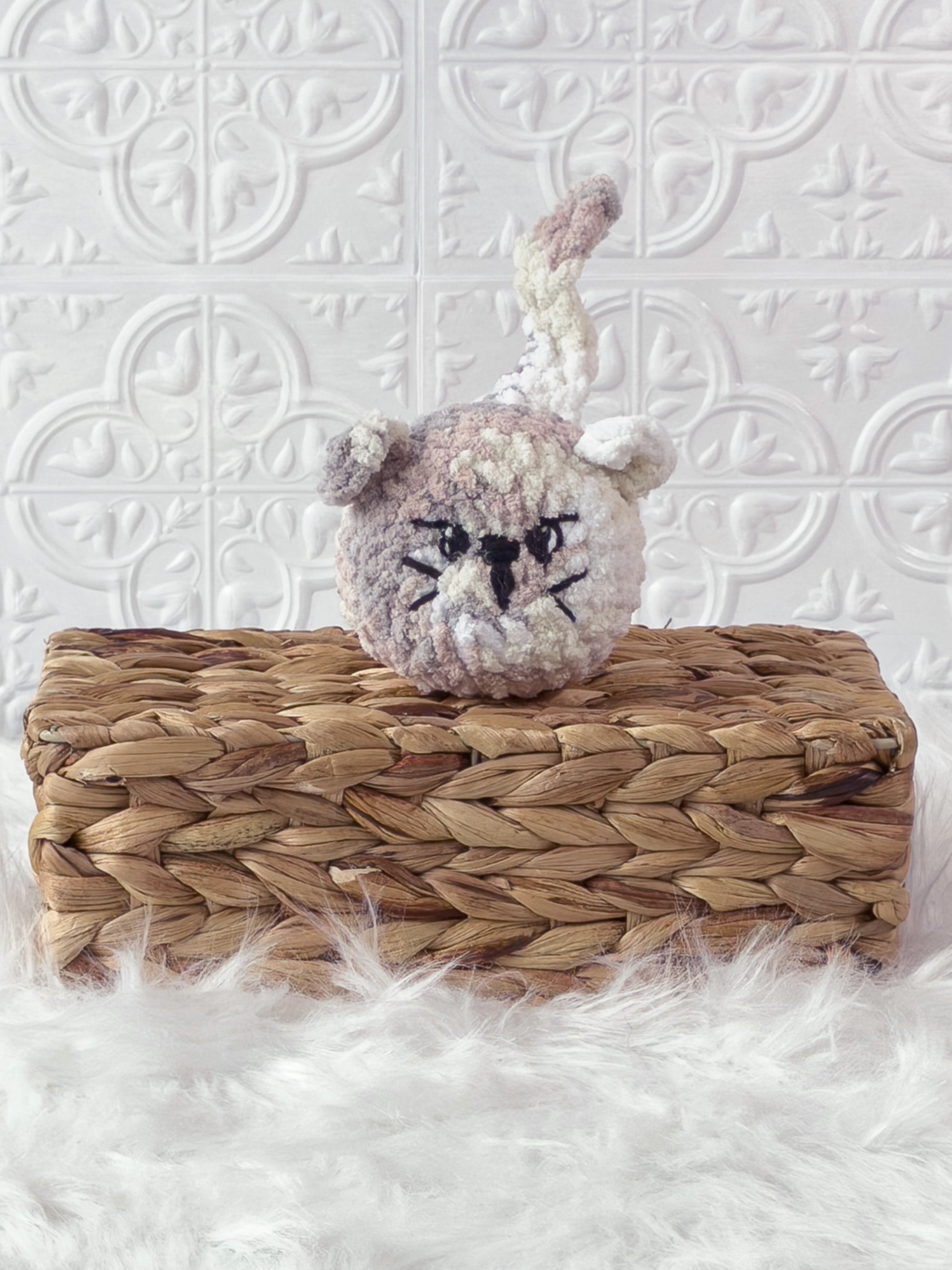Handmade multicolor angry cat crochet plushie shown from the front