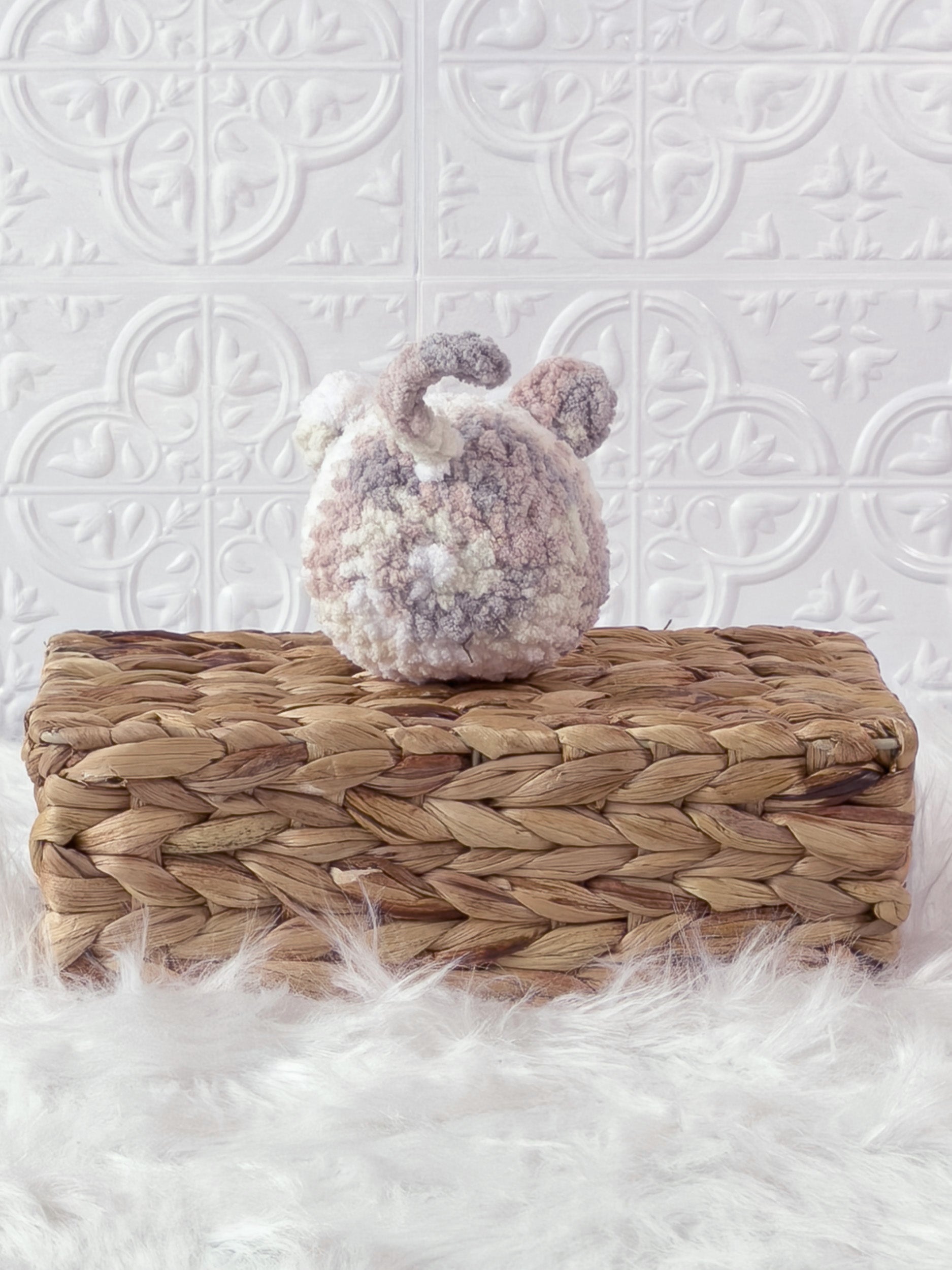 Handmade multicolor kitten crochet plushie shown from the back