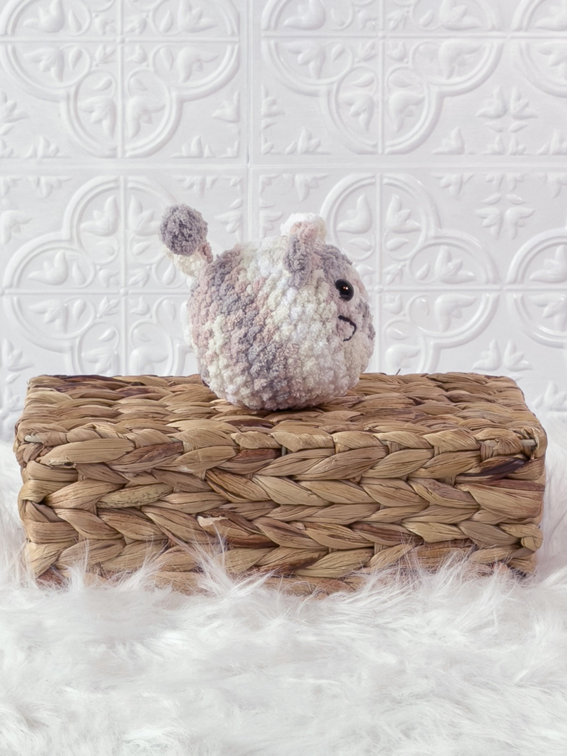 Handmade multicolor kitten crochet plushie shown from the side