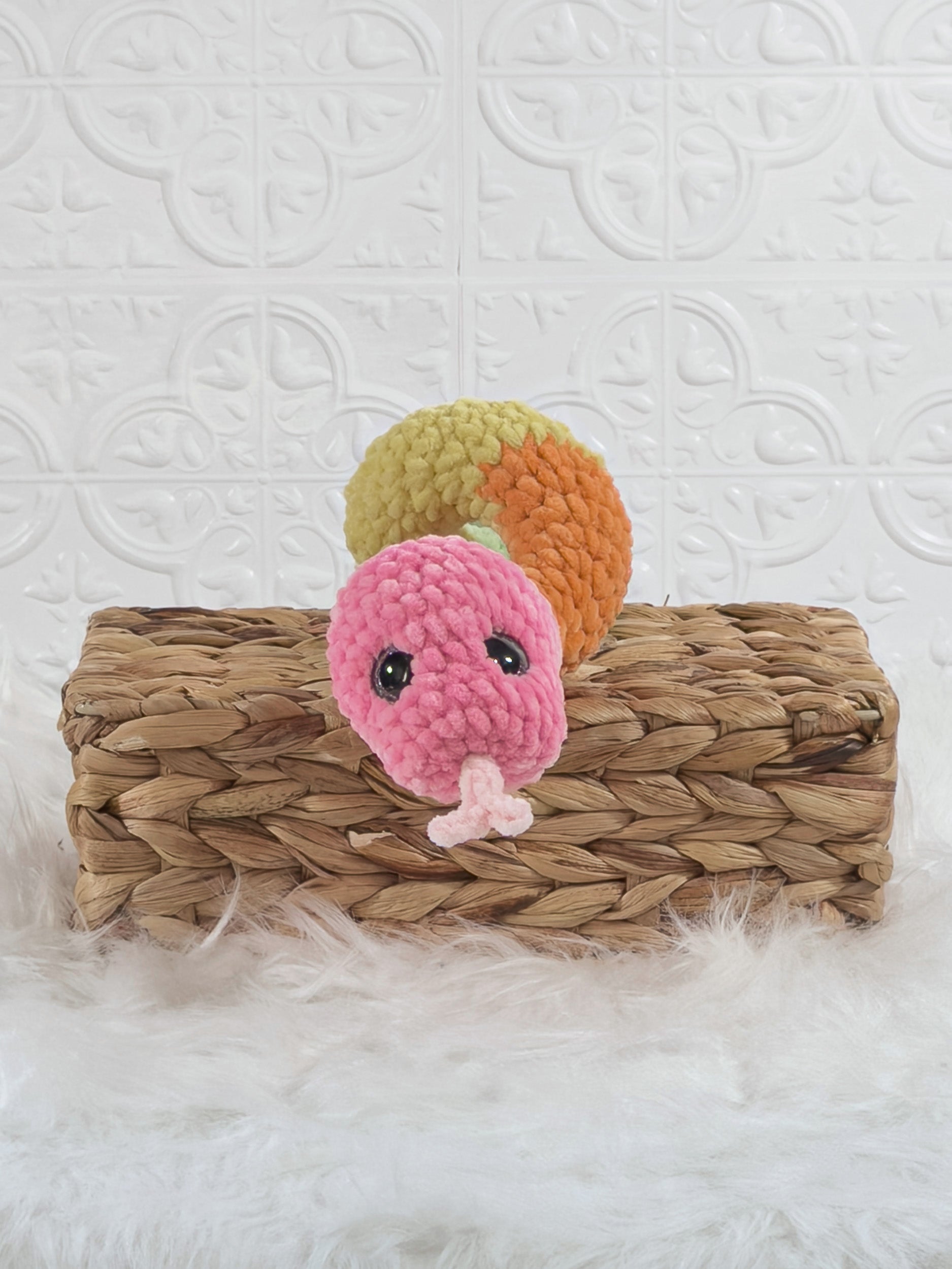 Handmade multicolor snake crochet plushie shown from the front